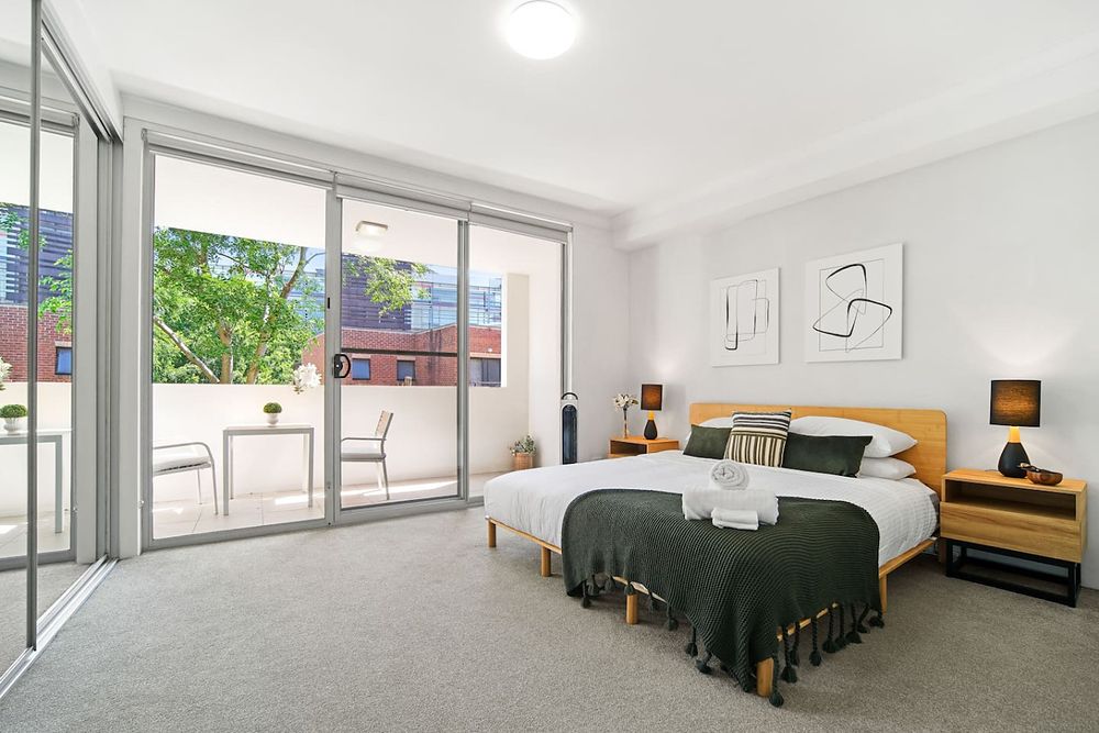 Bedroom with sliding doors to a balcony