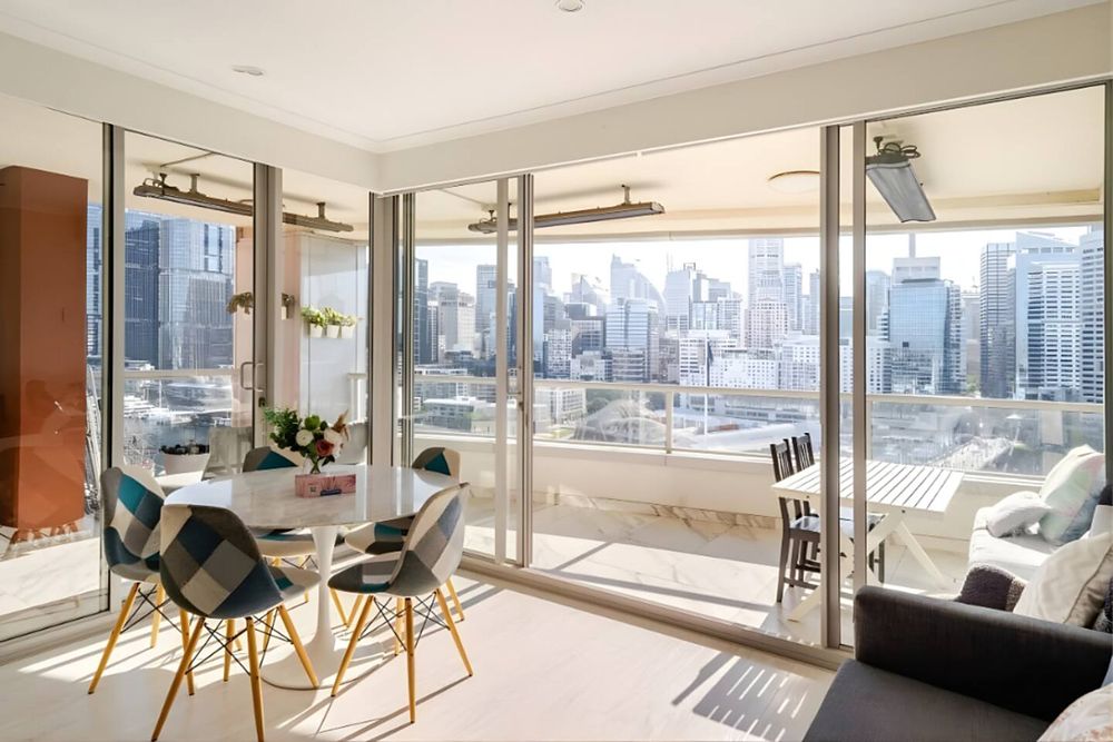 Bright dining space with the skyline through the windows