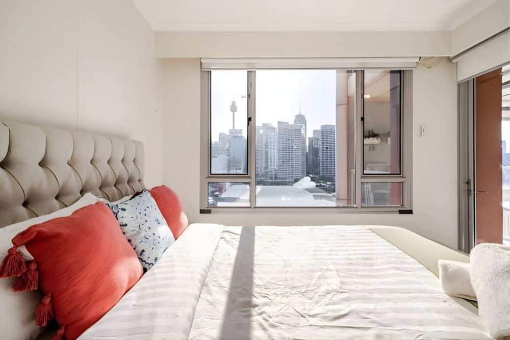 Bright bedroom with a city view