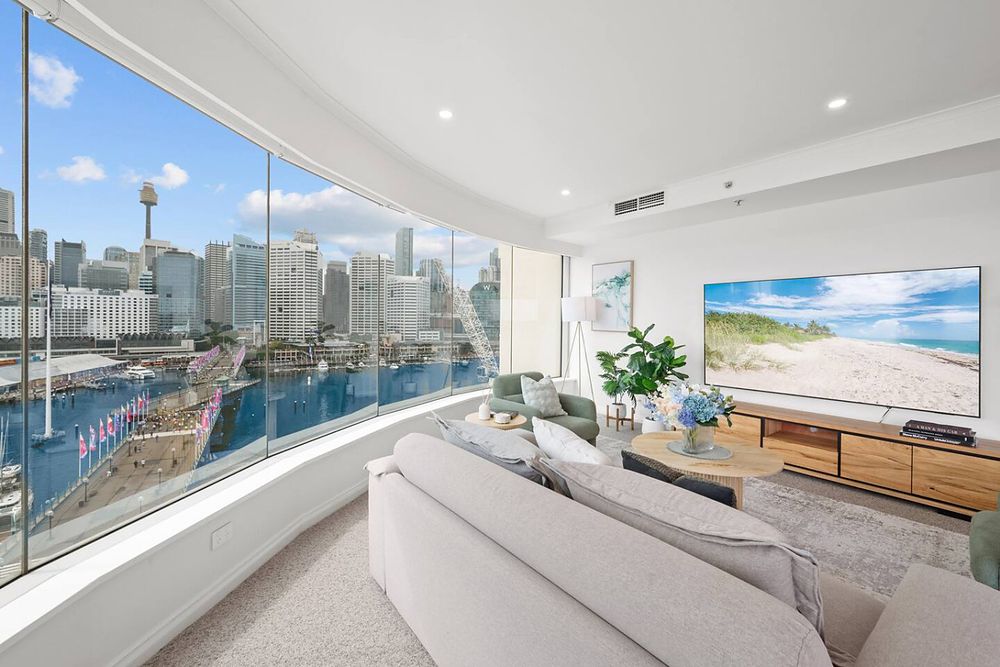 Living room with curved windows over the harbour